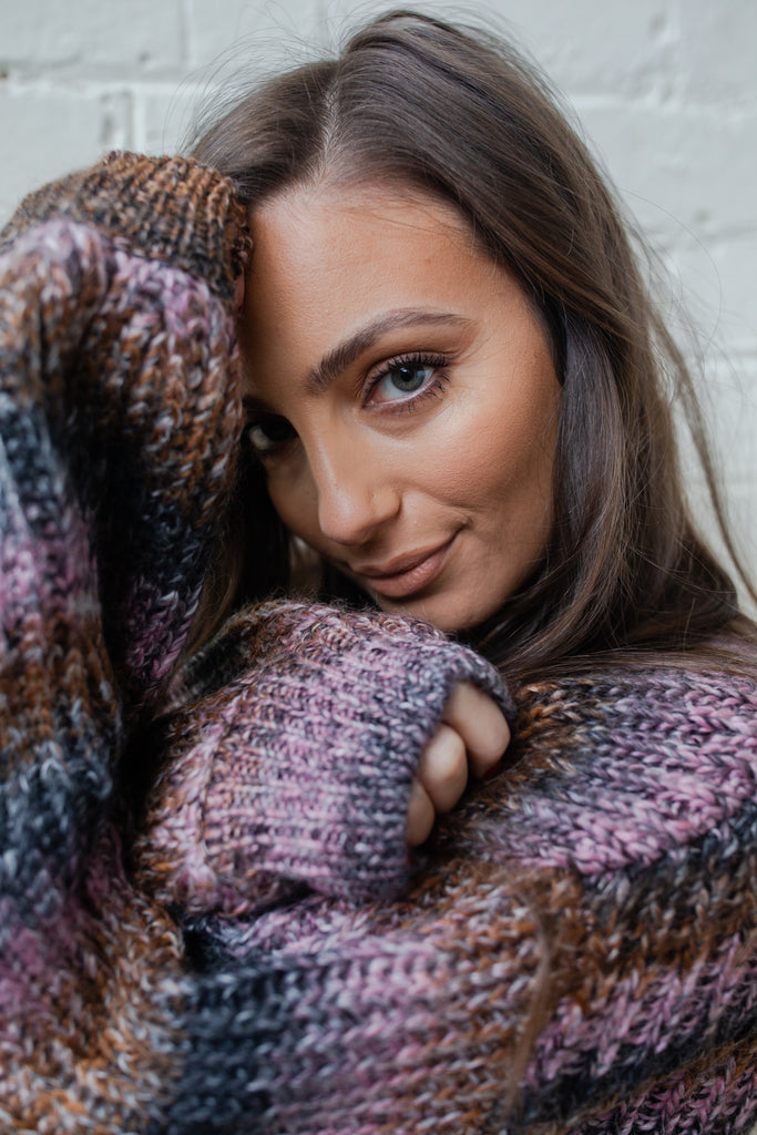 Stella Spacedye Sweater in an amazingly beautiful mix of pinks and chocolate brown and charcoals, worn by Adriana